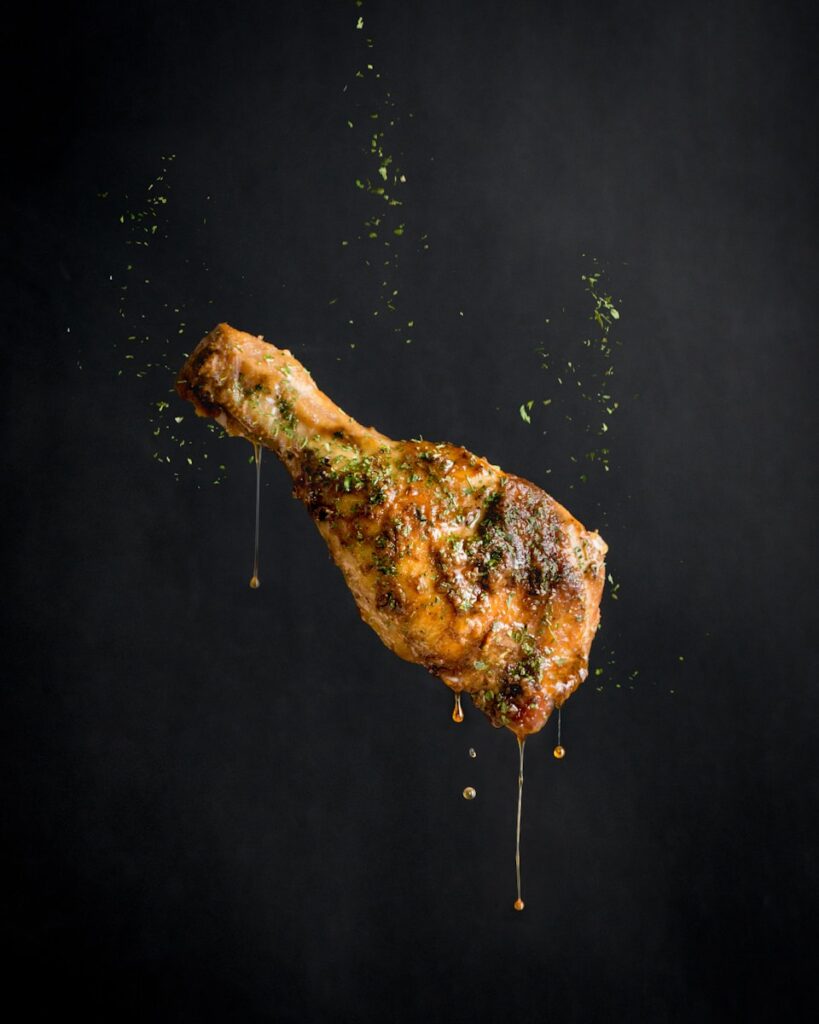 a piece of meat with sprinkles on it air fryer chicken legs​